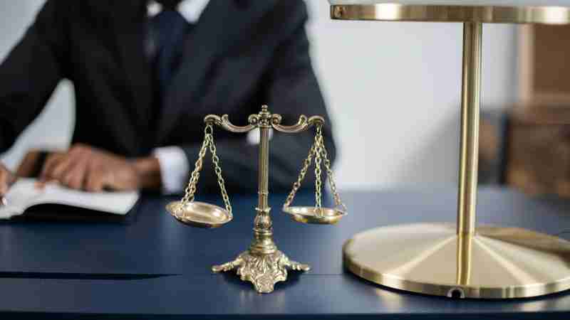 Elegant legal office with a close-up of golden scales of justice on a sleek dark desk., tags: der - pexel